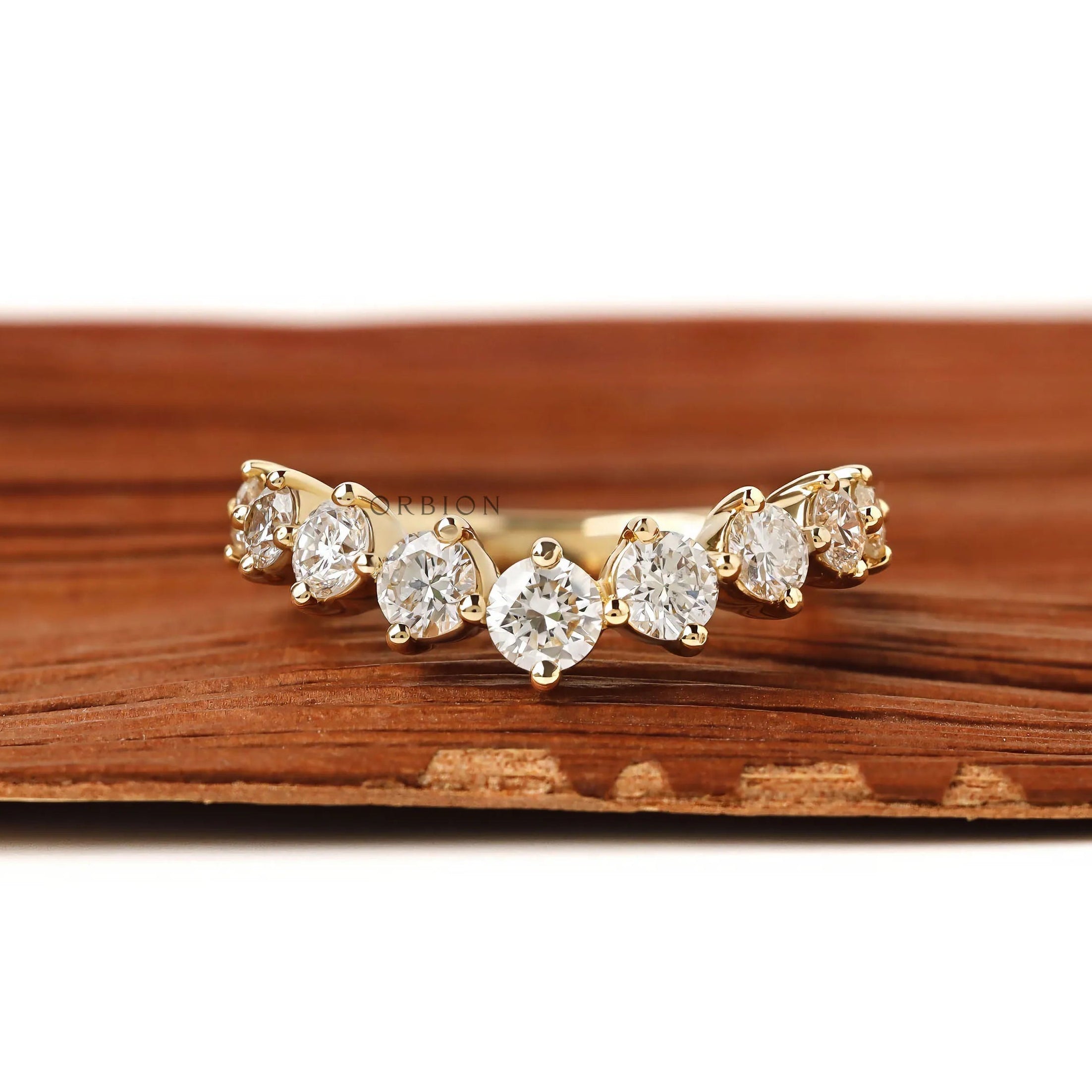 Minimalist curved diamond band in gold wishbone design