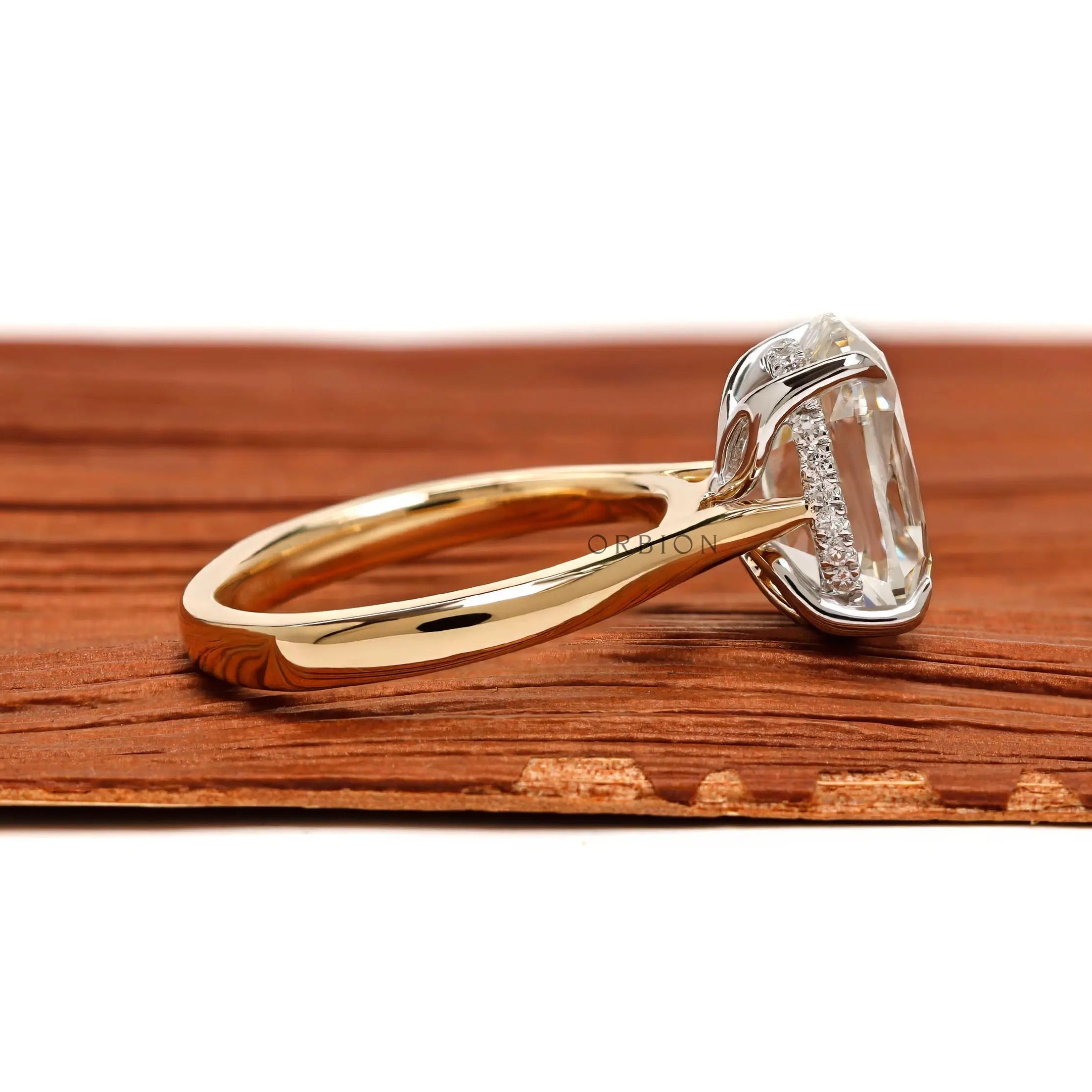 Side profile elongated cushion hidden halo engagement ring