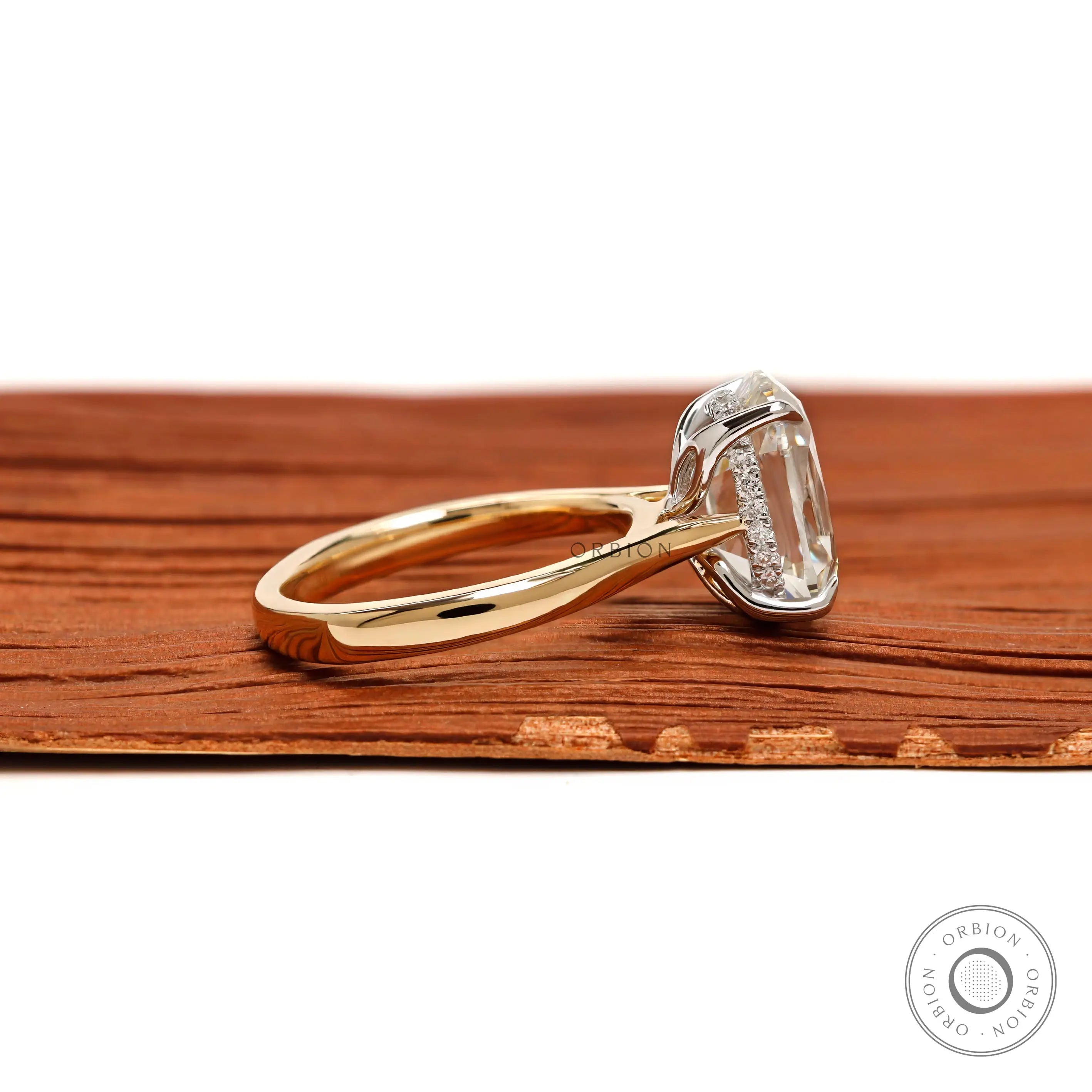 Side profile elongated cushion hidden halo engagement ring