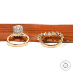 Back view of euro shank engagement ring and curved stacking band