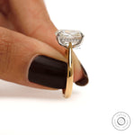 Side finger view elongated cushion solitaire engagement ring