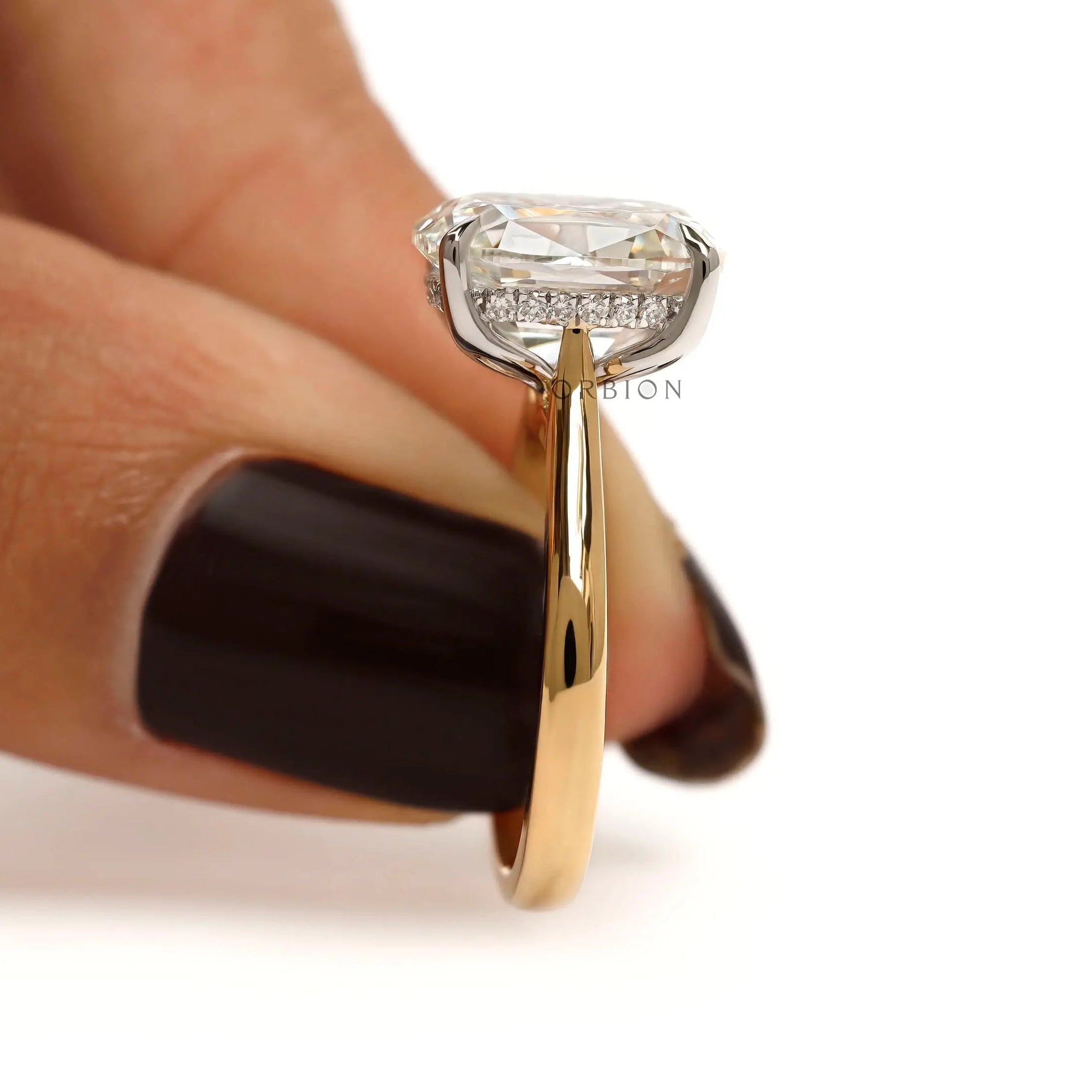 Side finger view elongated cushion solitaire engagement ring