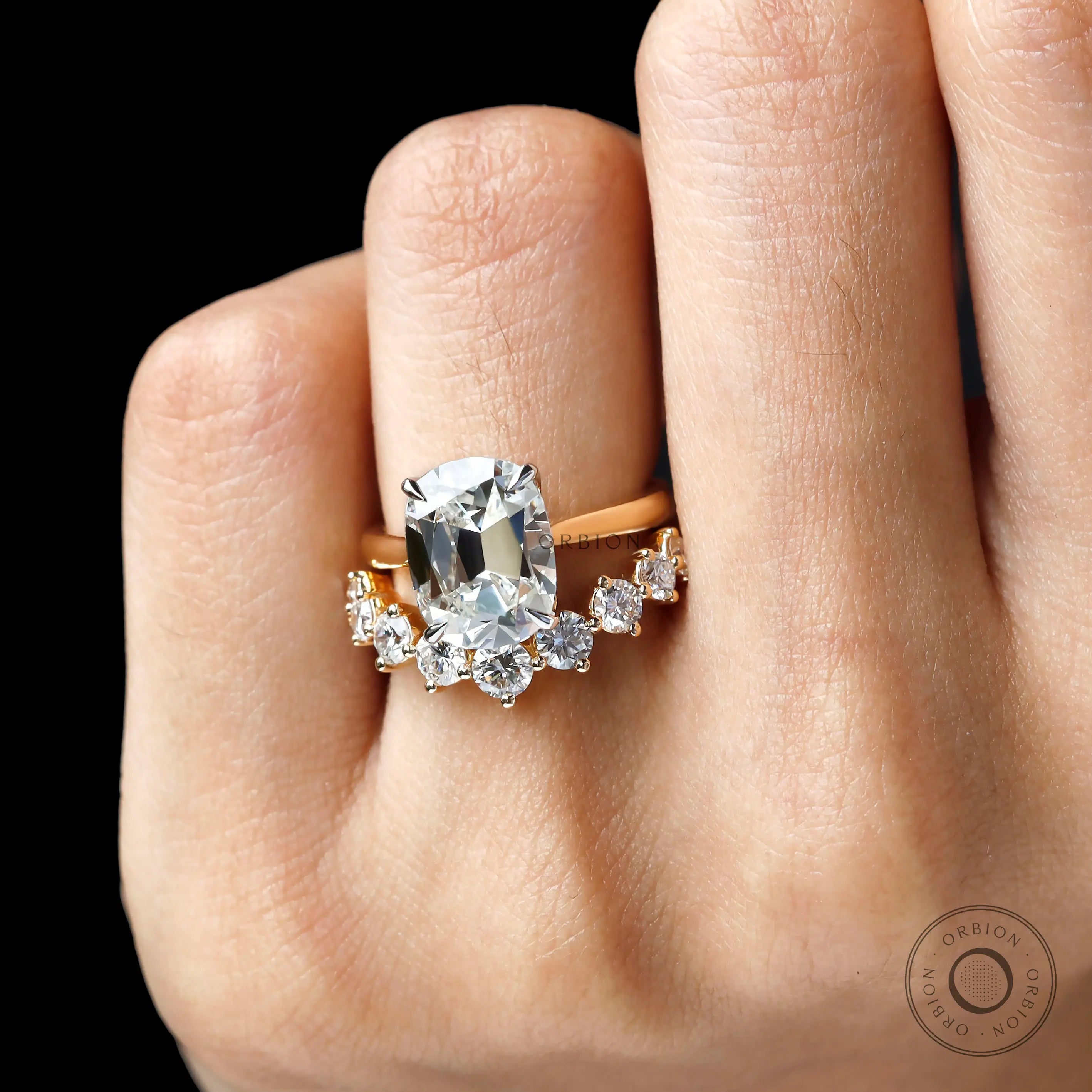 Top hand view of hidden halo engagement ring with curved band