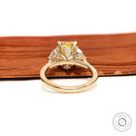 Back gallery view of three stone yellow diamond engagement ring