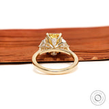 Back gallery view of three stone yellow diamond engagement ring