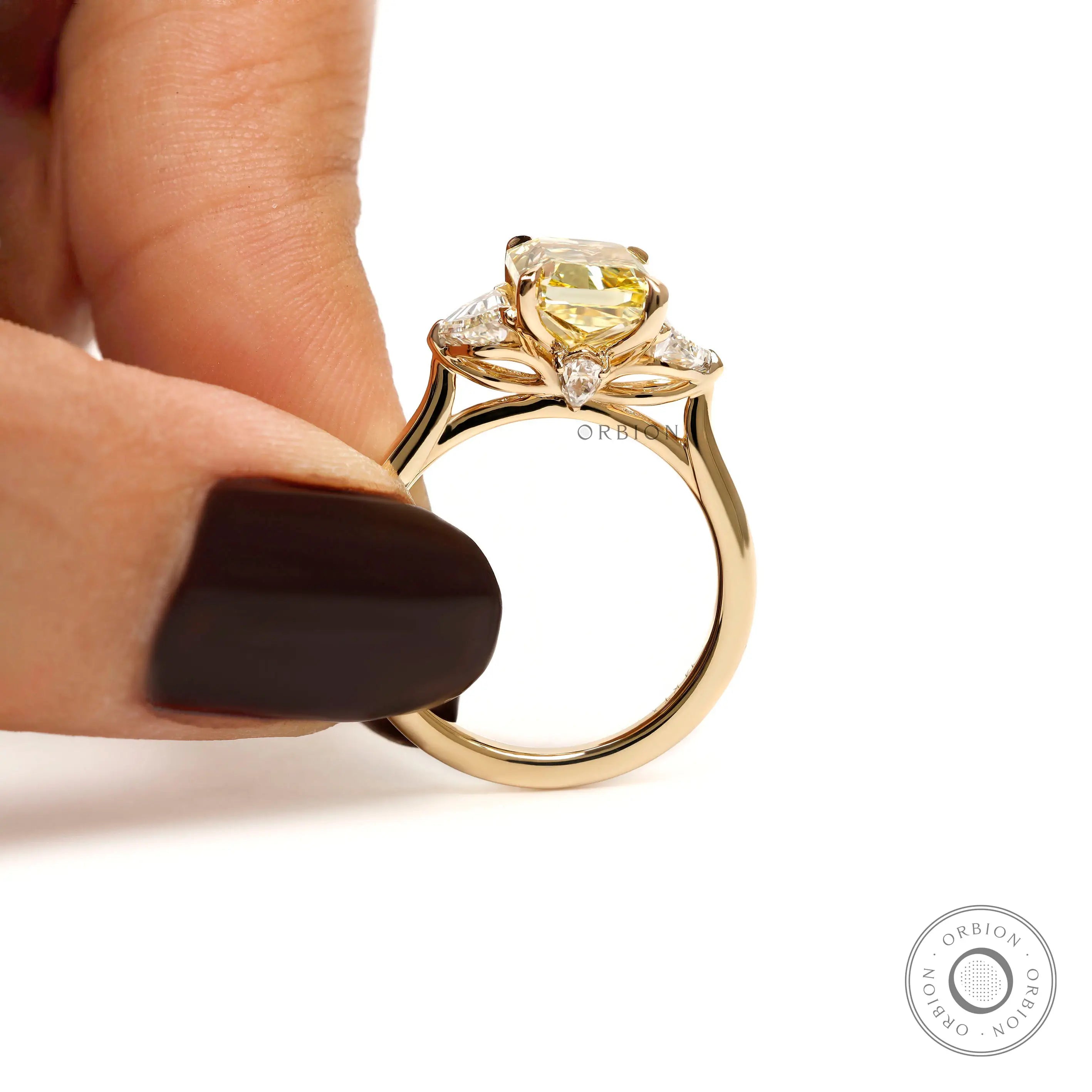 Detailed side gallery of radiant yellow diamond ring with accents