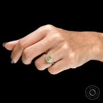 Radiant yellow diamond three stone engagement ring shown on hand