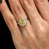 Top hand view radiant yellow diamond three stone engagement ring