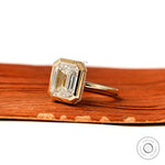 2.5 ct emerald cut lab diamond bezel halo solitaire ring close view