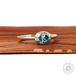 Minimalist oval moissanite bezel engagement ring yellow gold band