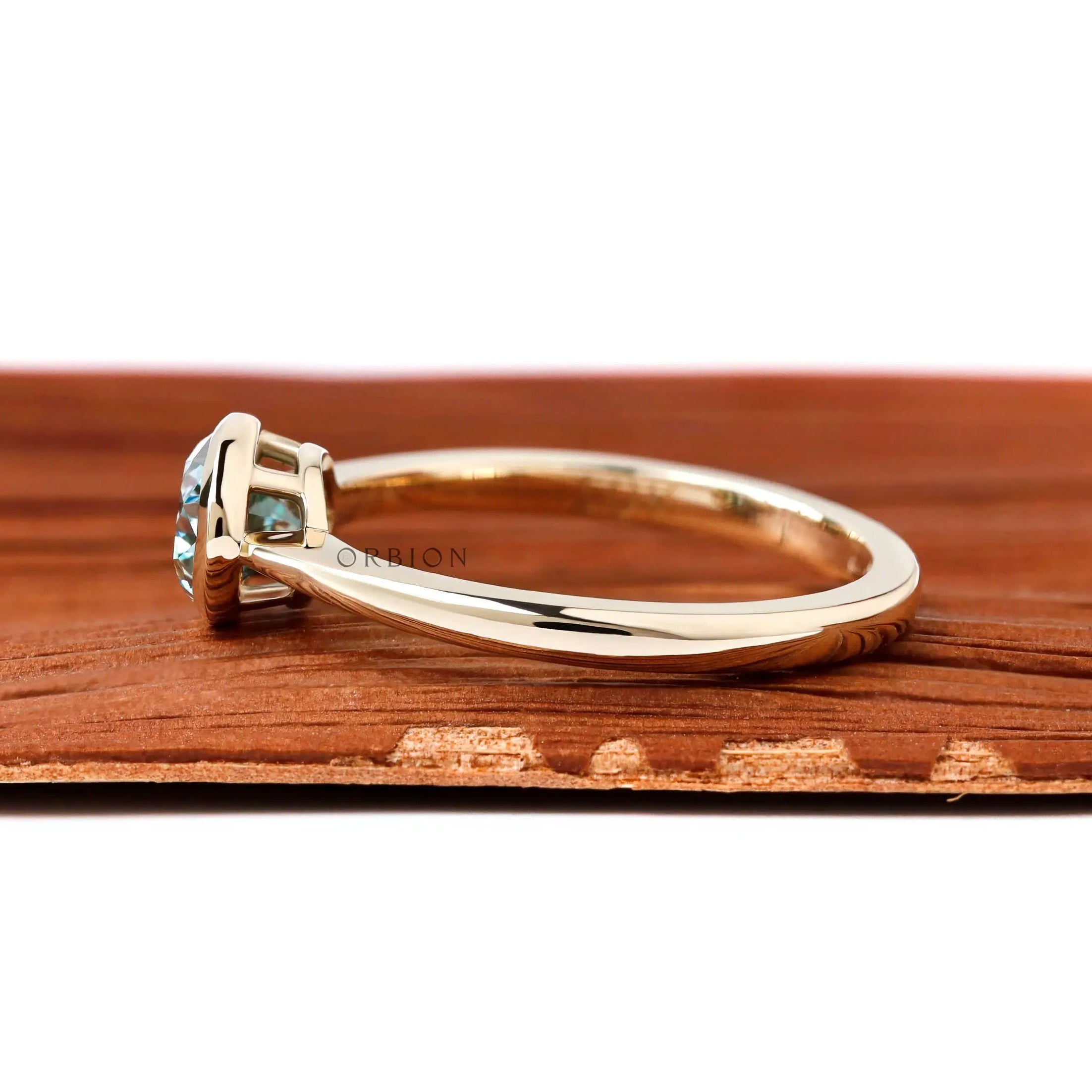 Dainty east west oval moissanite solitaire ring glossy yellow gold