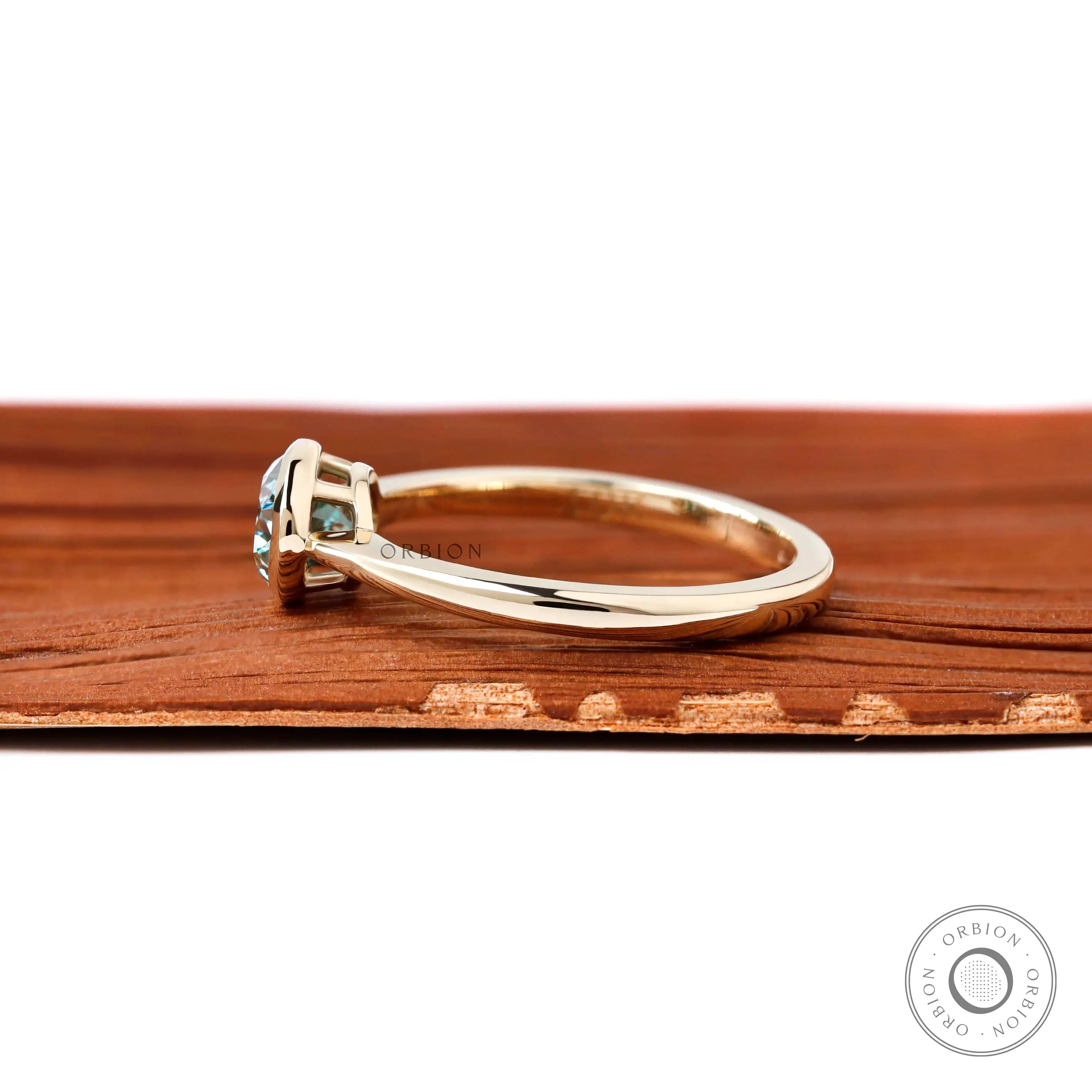 Dainty east west oval moissanite solitaire ring glossy yellow gold