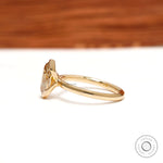 Side profile showing slim yellow gold floating bezel