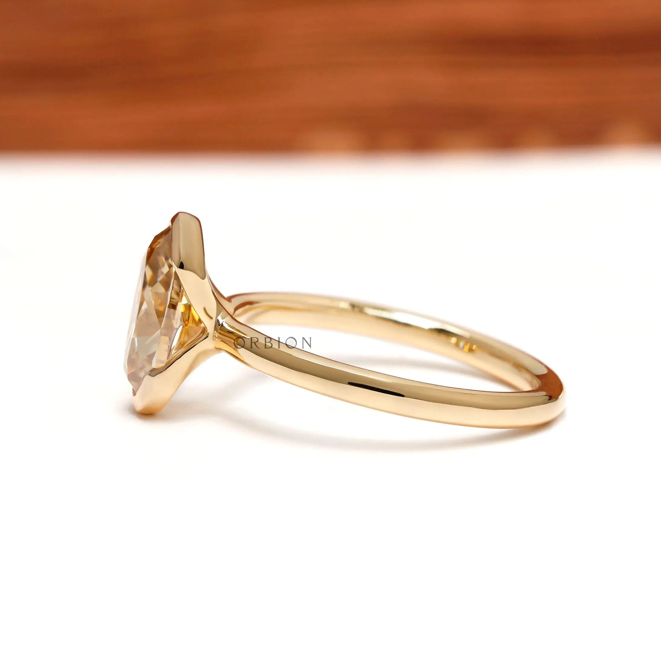 Side profile showing slim yellow gold floating bezel