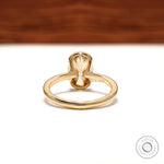 Back view showing open gallery under oval moissanite bezel