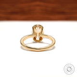 Back view showing open gallery under oval moissanite bezel
