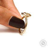 Hand holding ring, side view of half bezel setting