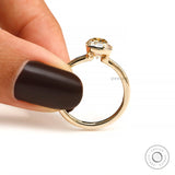 Hand held closeup showing open bezel sides, thin band