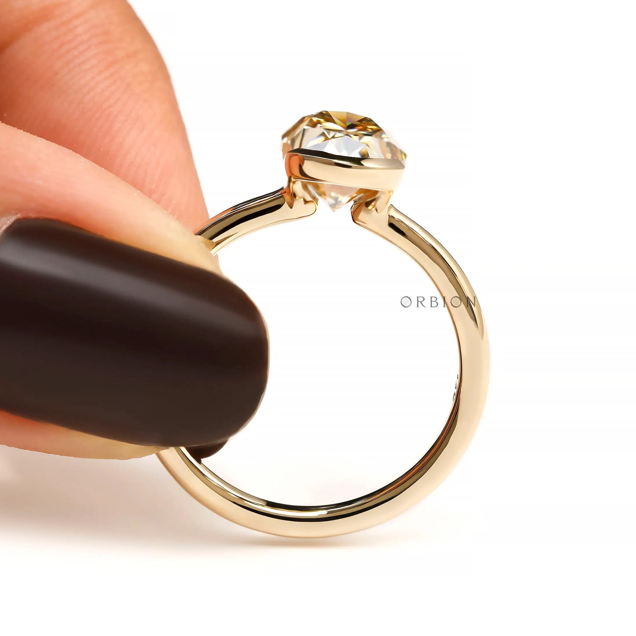 Hand held closeup showing open bezel sides, thin band