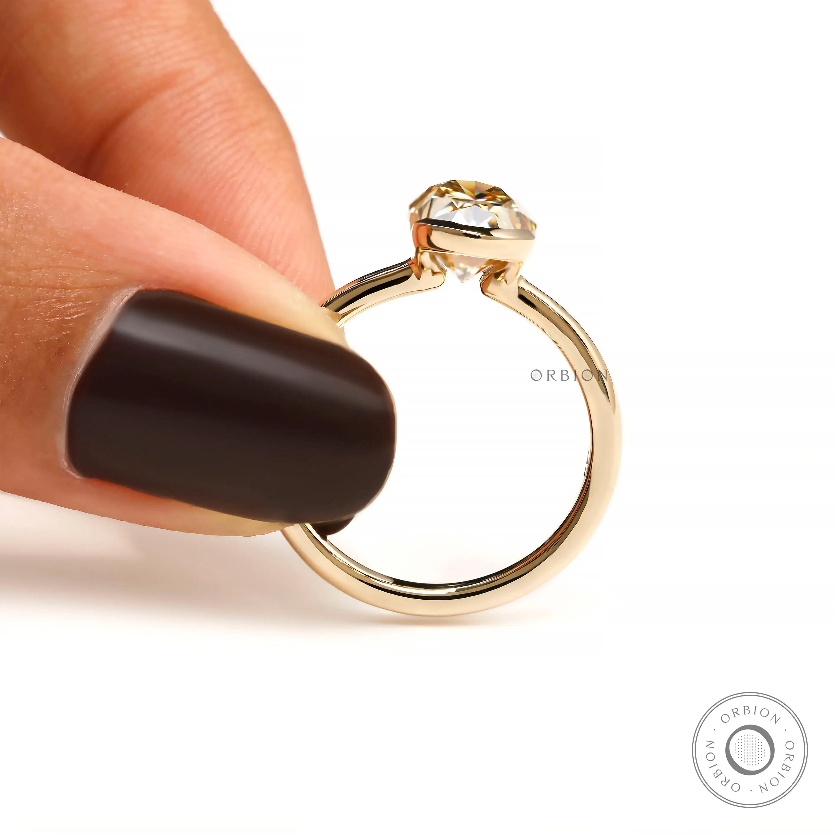 Hand held closeup showing open bezel sides, thin band