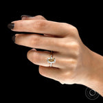 On hand top view of oval champagne moissanite engagement ring