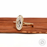 Angled view elongated moval bezel set lab diamond ring