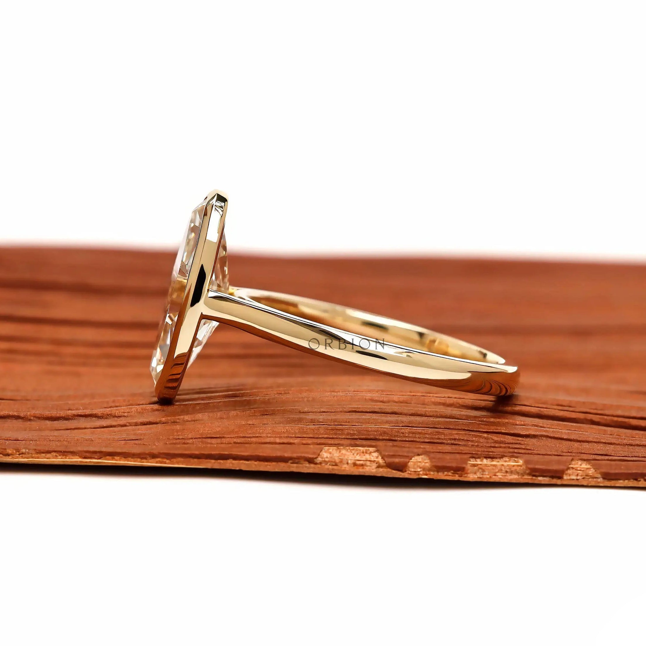 Side profile cathedral setting moval bezel engagement ring