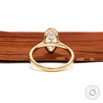 Back view moval bezel solitaire ring in yellow gold