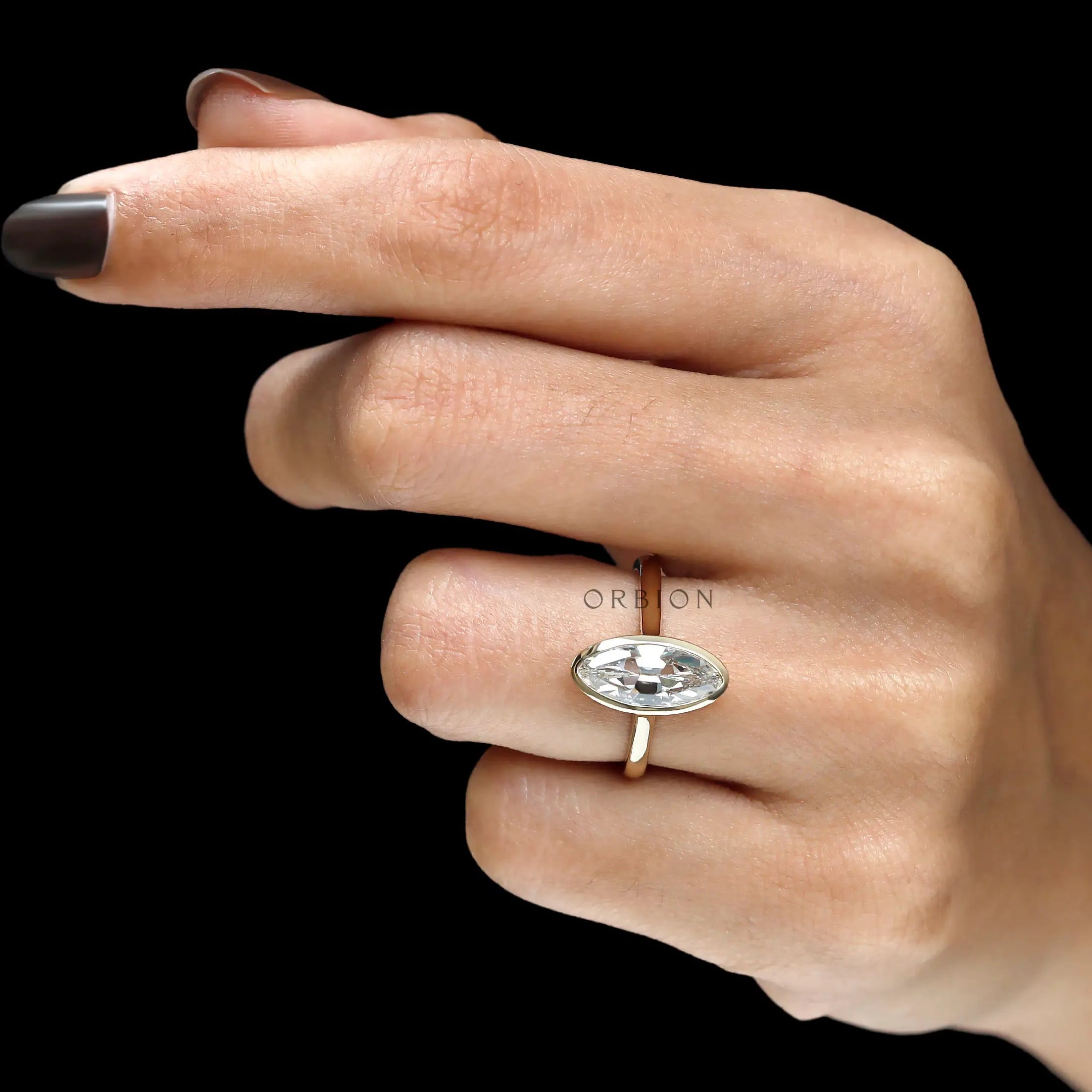 Hand shot antique OMC moval bezel set diamond ring