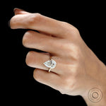 Hand shot old mine cut pear moissanite bypass solitaire ring