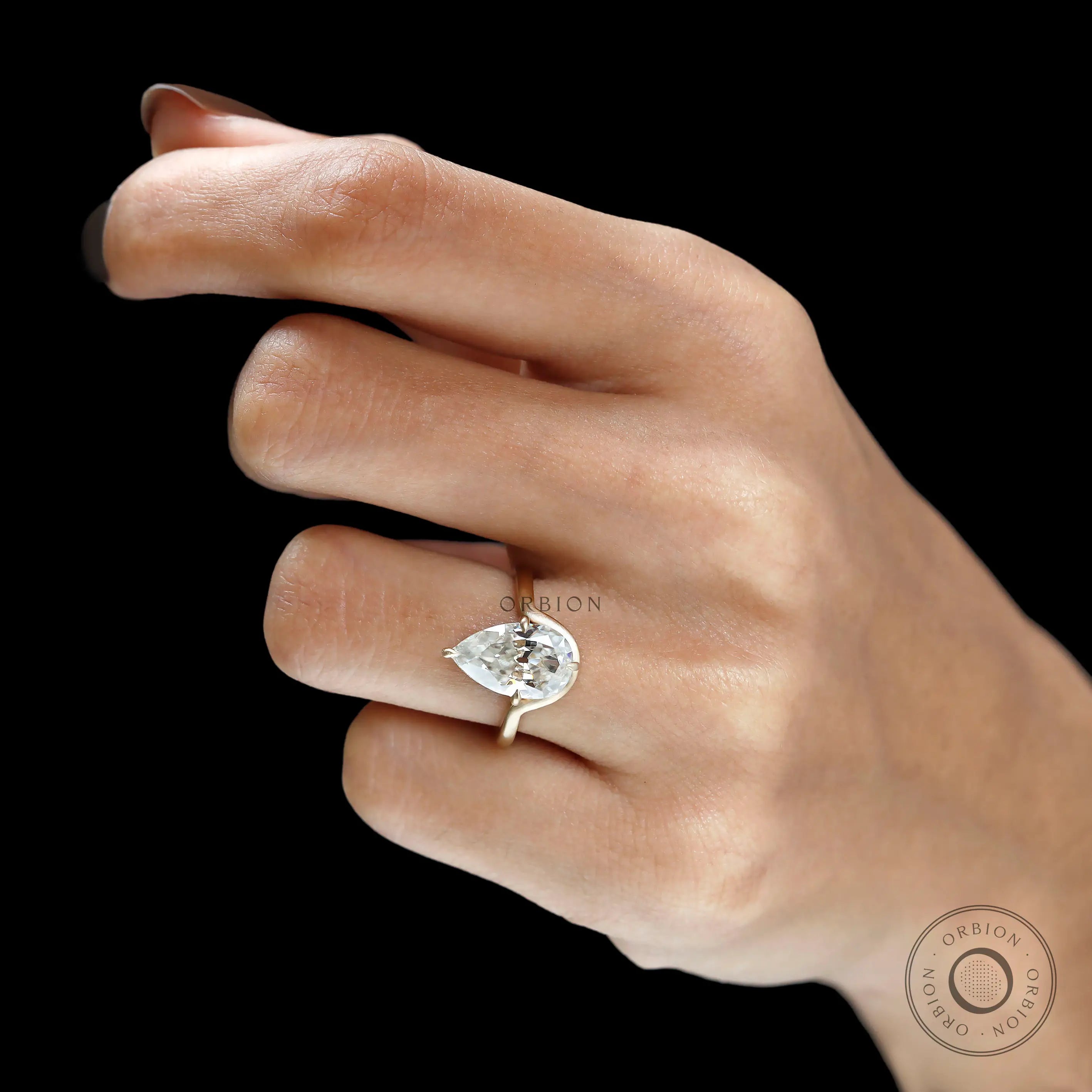 Hand shot old mine cut pear moissanite bypass solitaire ring