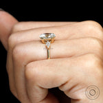 Closeup of oval center diamond and kite accents
