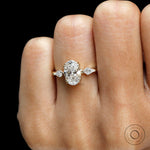 Trilogy engagement ring scale shot on hand, black background