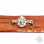 Oval lab grown diamond ring with round side stones front view