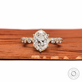 Oval lab grown diamond ring with round side stones front view