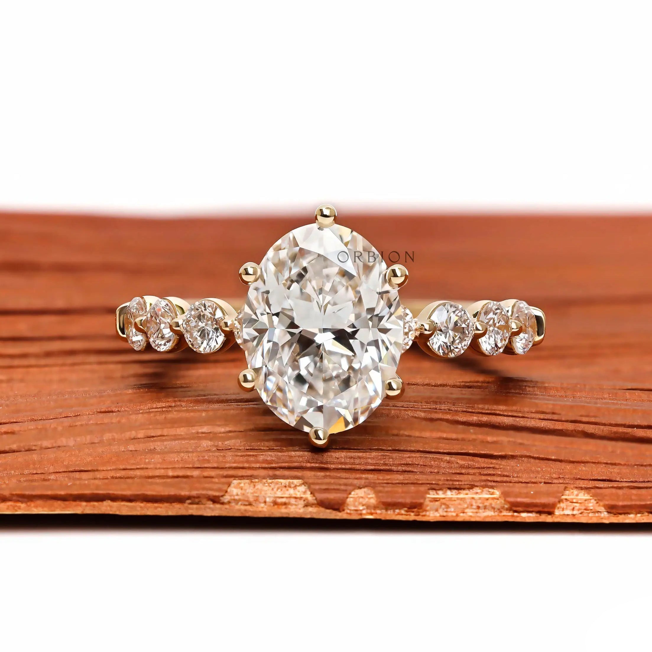 Oval lab grown diamond ring with round side stones front view