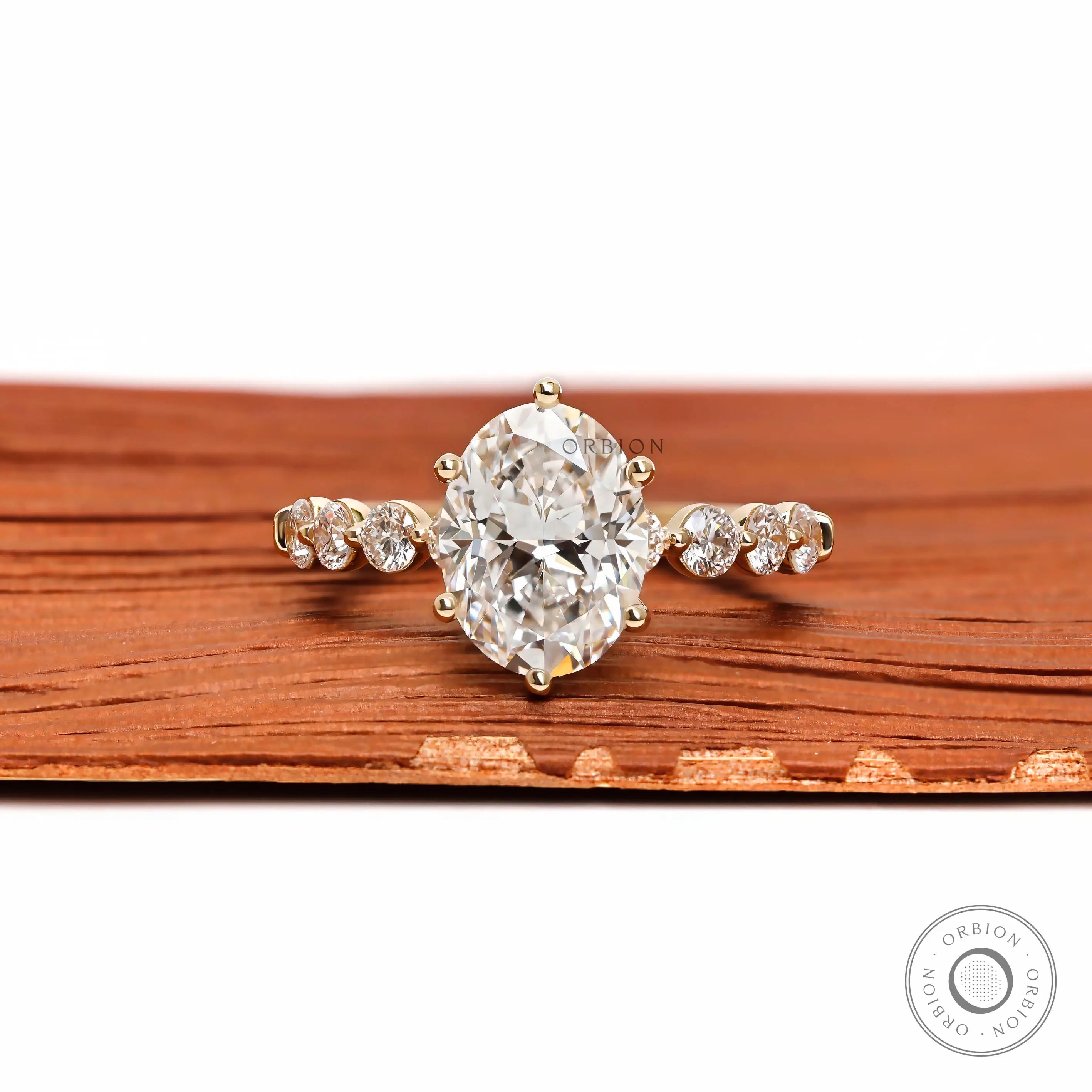 Oval lab grown diamond ring with round side stones front view