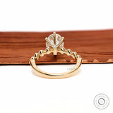 Back gallery view oval diamond ring with hidden accent