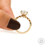 Gallery side view oval diamond ring with hidden accent stone