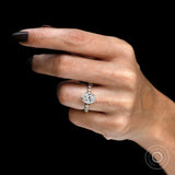 Close-up hand view oval diamond ring with round accents