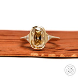 Front view elongated champagne cushion moissanite ring with triangle side stones