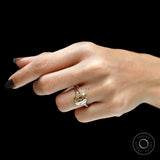Hand shot elongated champagne cushion moissanite ring in yellow gold