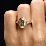 Close front hand view champagne moissanite ring with triangle sides