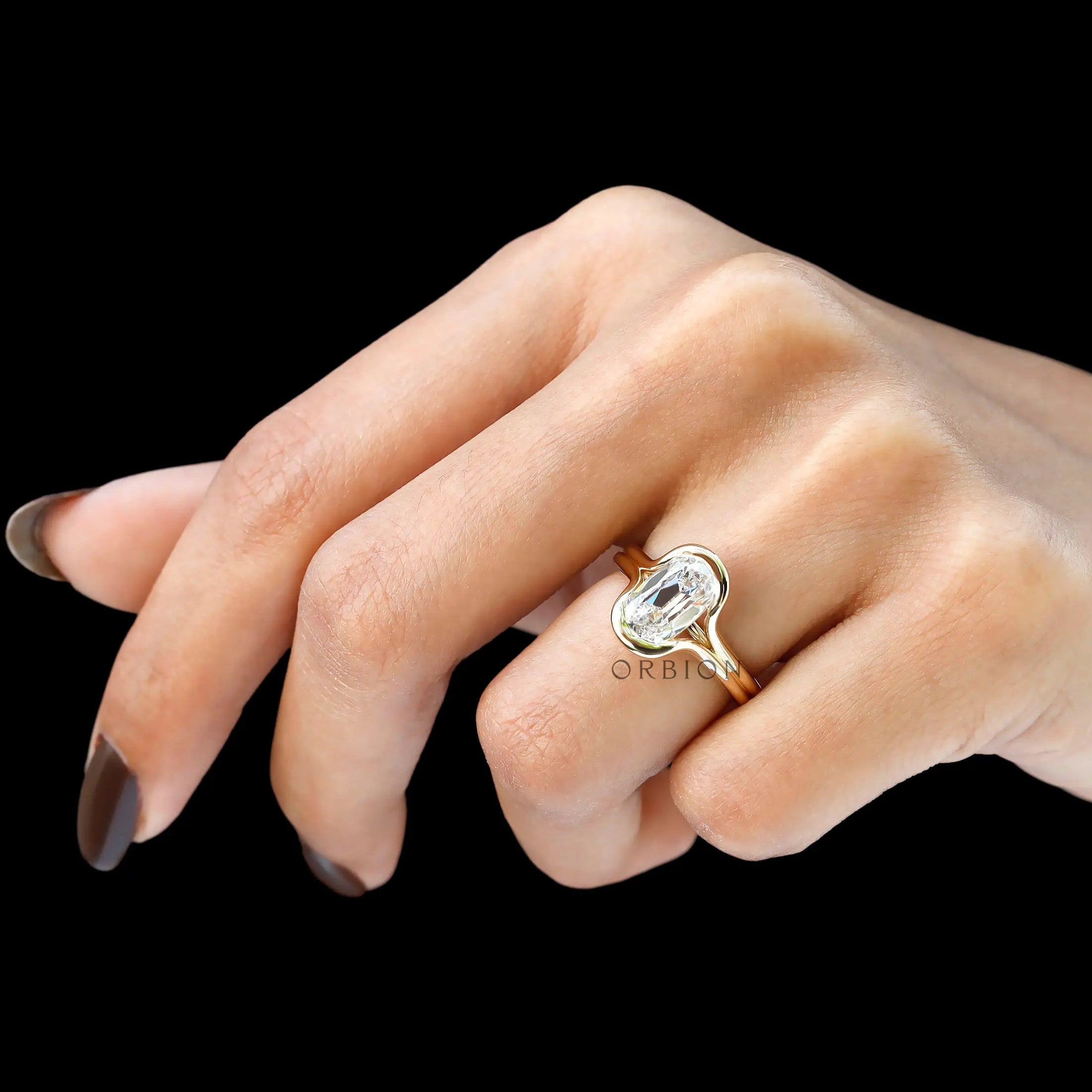 Side hand view floating split shank yellow gold ring