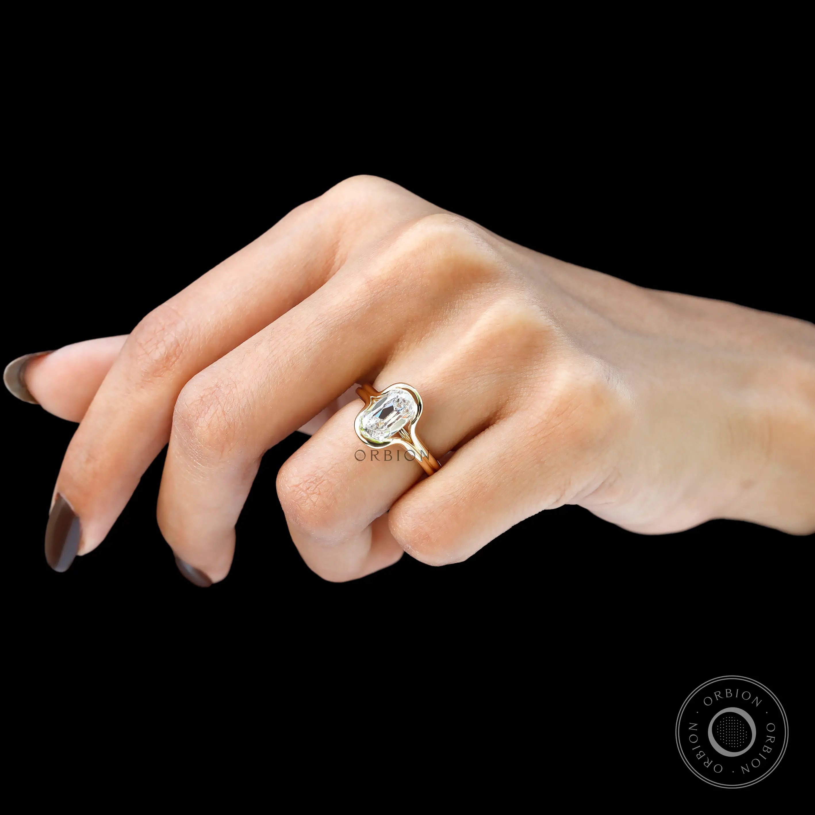 Side hand view floating split shank yellow gold ring