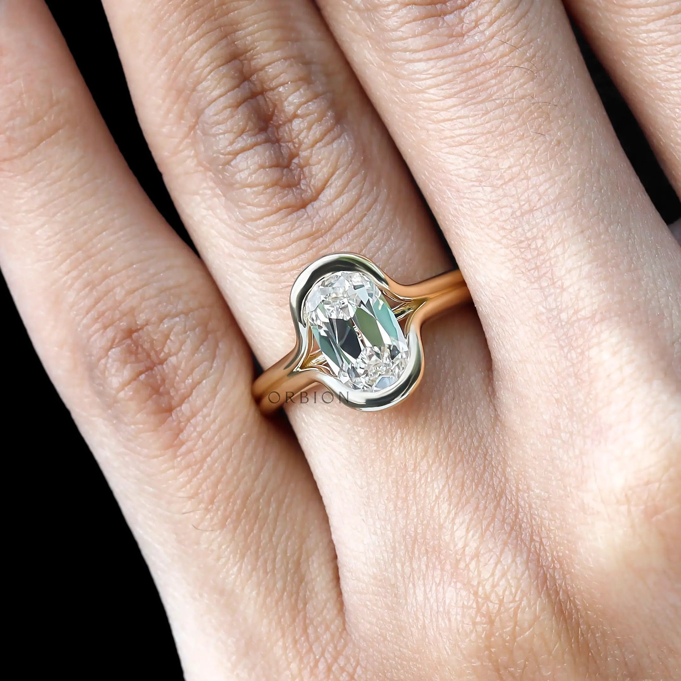 Top hand view elongated cushion lab diamond engagement ring