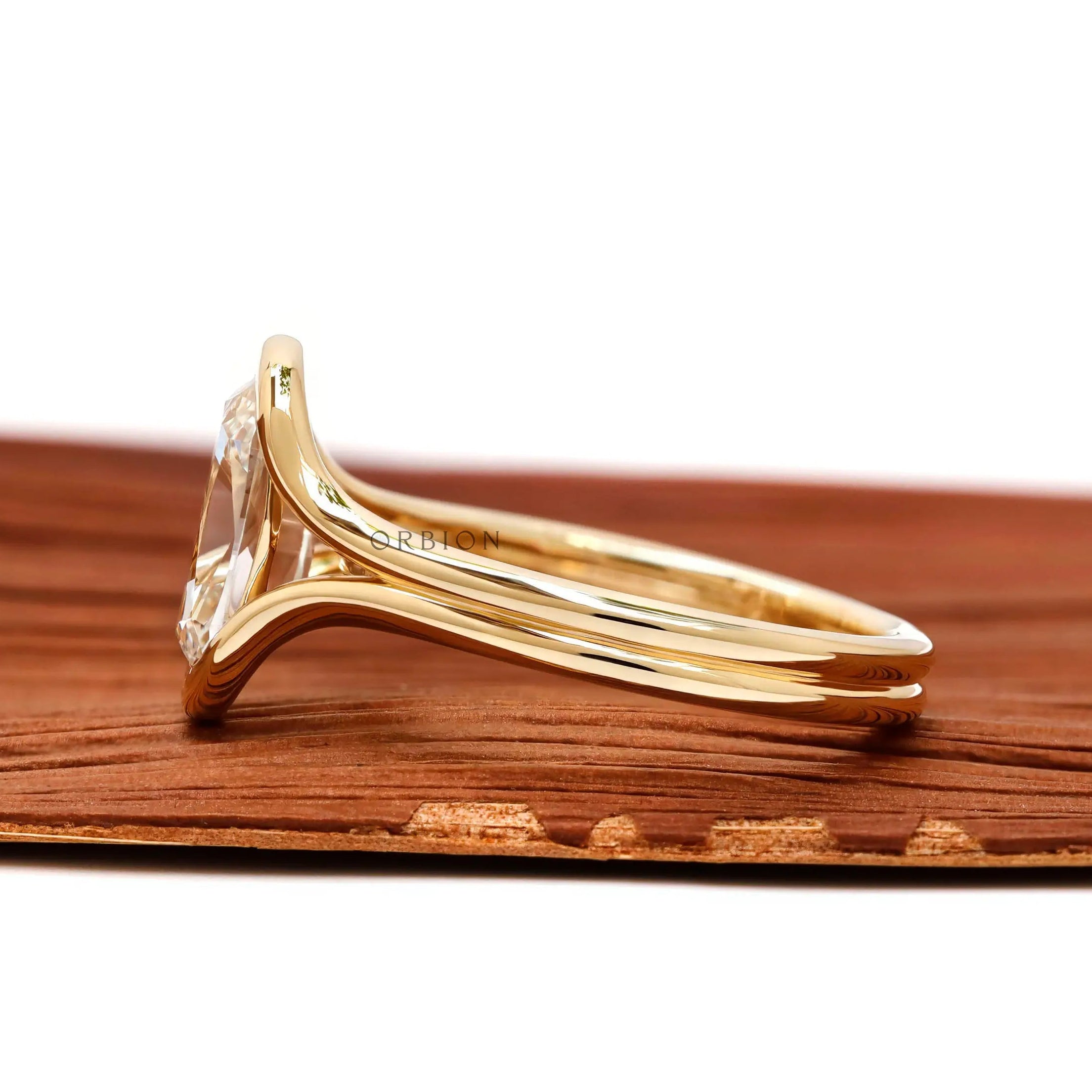 Side profile elongated cushion lab diamond ring in yellow gold