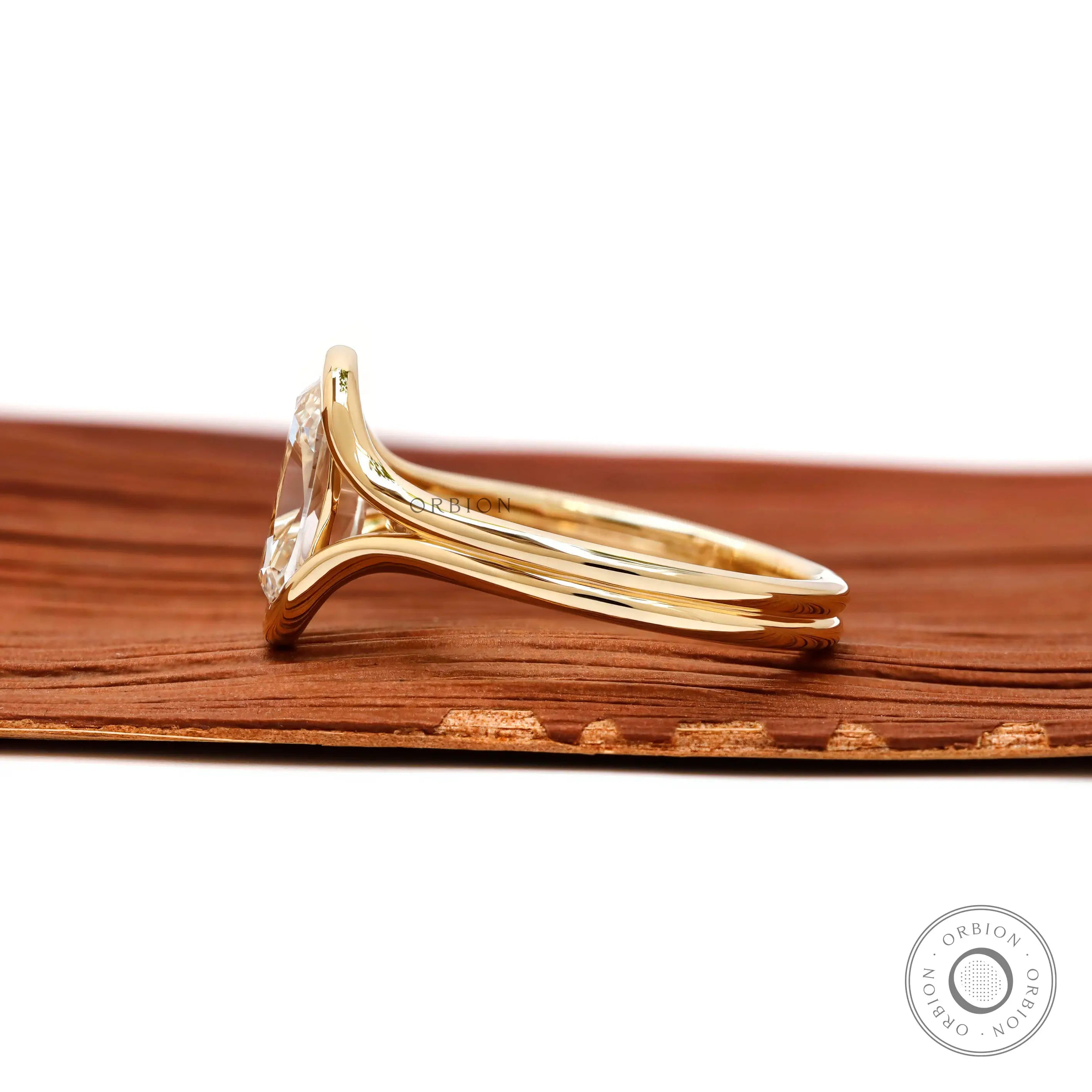 Side profile elongated cushion lab diamond ring in yellow gold