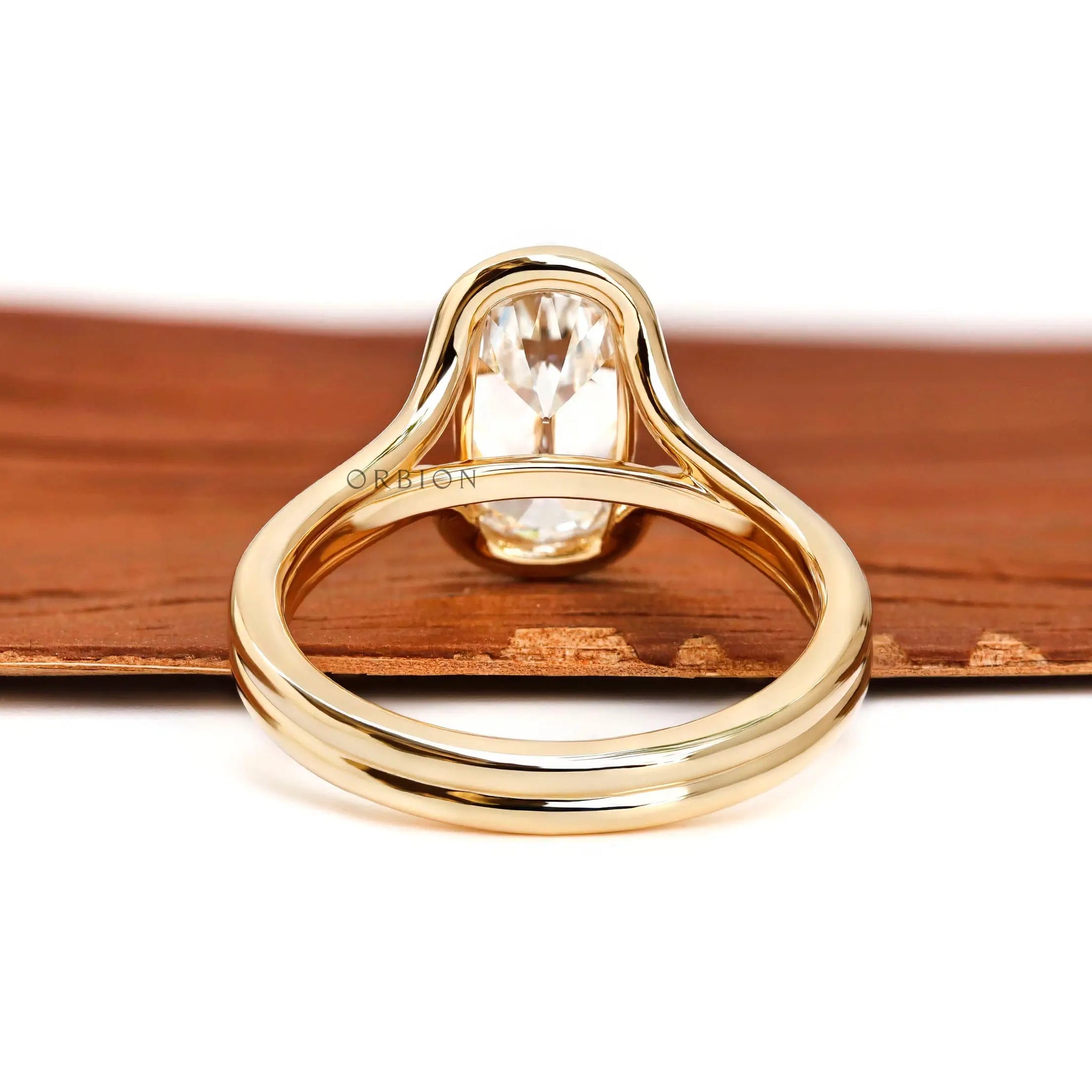 Rear view floating split shank engagement ring with open gallery