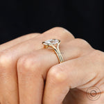 Hand view floating elongated cushion lab diamond ring